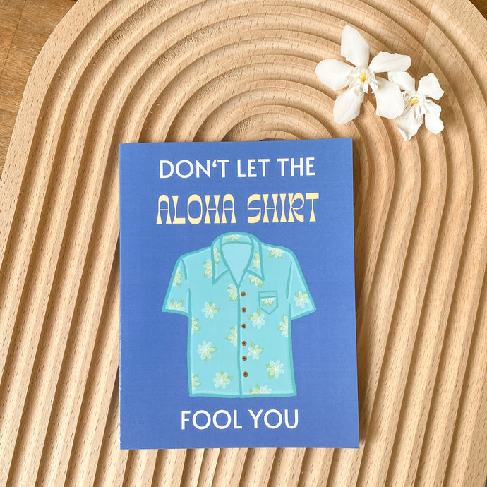 Blue father's day card on beige wood backdrop